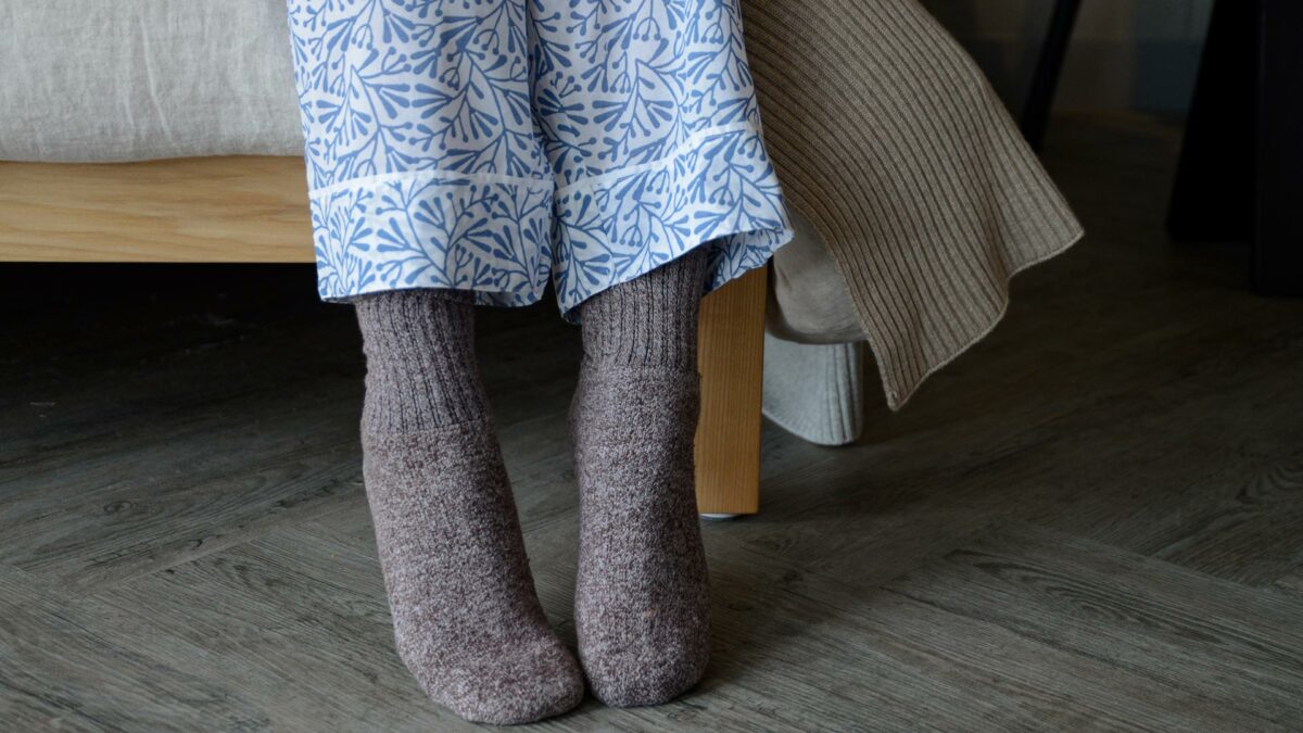 lightweight white cotton pjs with a block print leaf design in blue showing the ankle cuffs