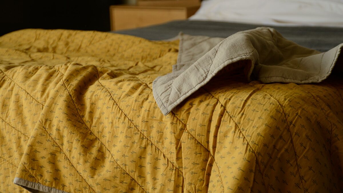block print look patterned throw turmeric and mushroom