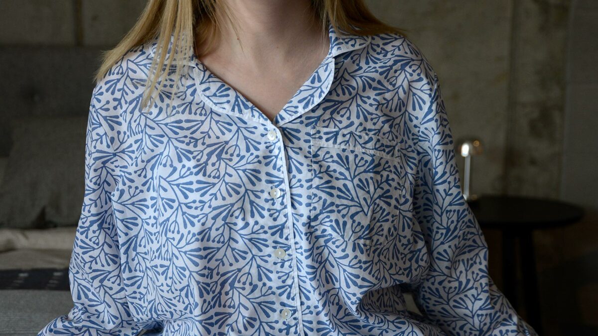 lightweight white cotton pyjamas with a block print leaf design in blue a closer view of the top