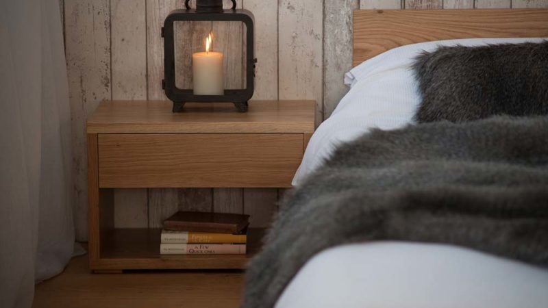 Rustic look bedroom using our low cube bedside table in Oak