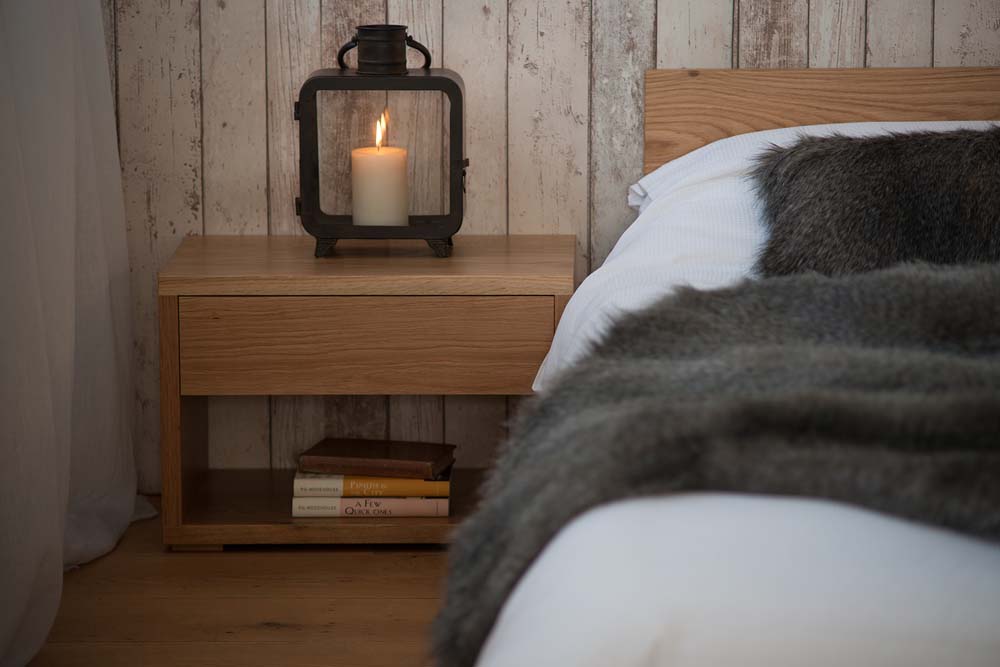 Rustic look bedroom using our low cube bedside table in Oak