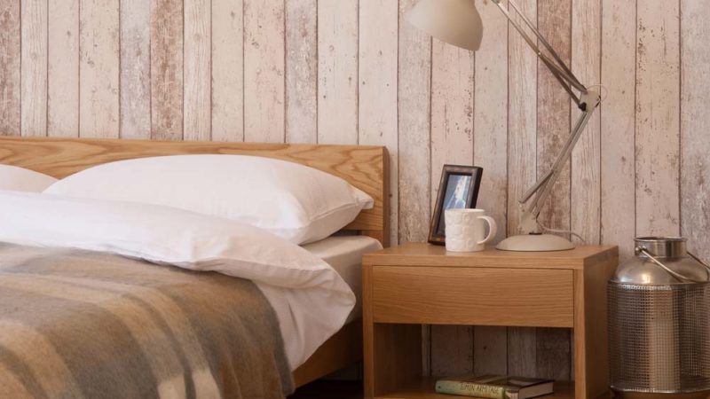 A Rustic bedroom look featuring our low wooden Nevada bed made from Oak