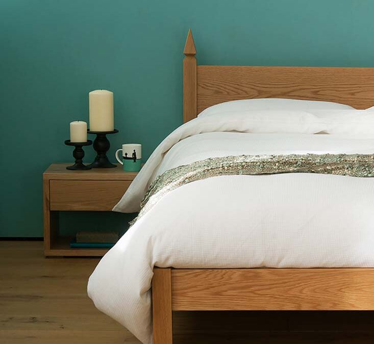 Our low Cube bedside table can be made in a choice of wood to match your bed.