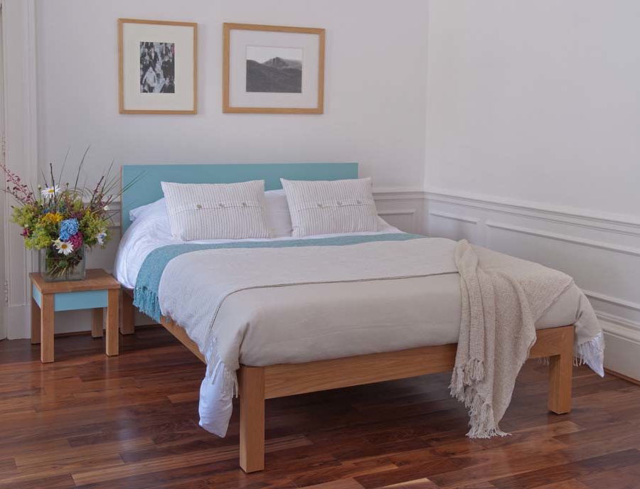 guest bedroom styles - Tao wooden bed frame with a colourful painted headboard