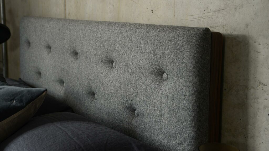 A closer view of the buttoned upholstered Bloomsbury bed headboard