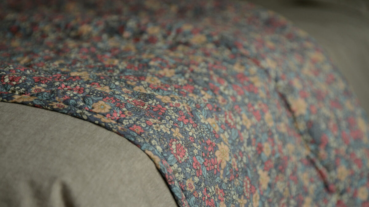 blue and pink floral printed throw