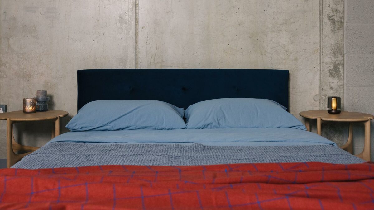 blue and red bedding on Iona bed