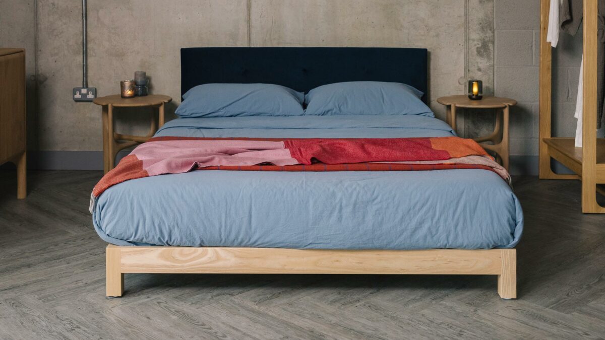 blue and red bedding on an ash Iona low bed