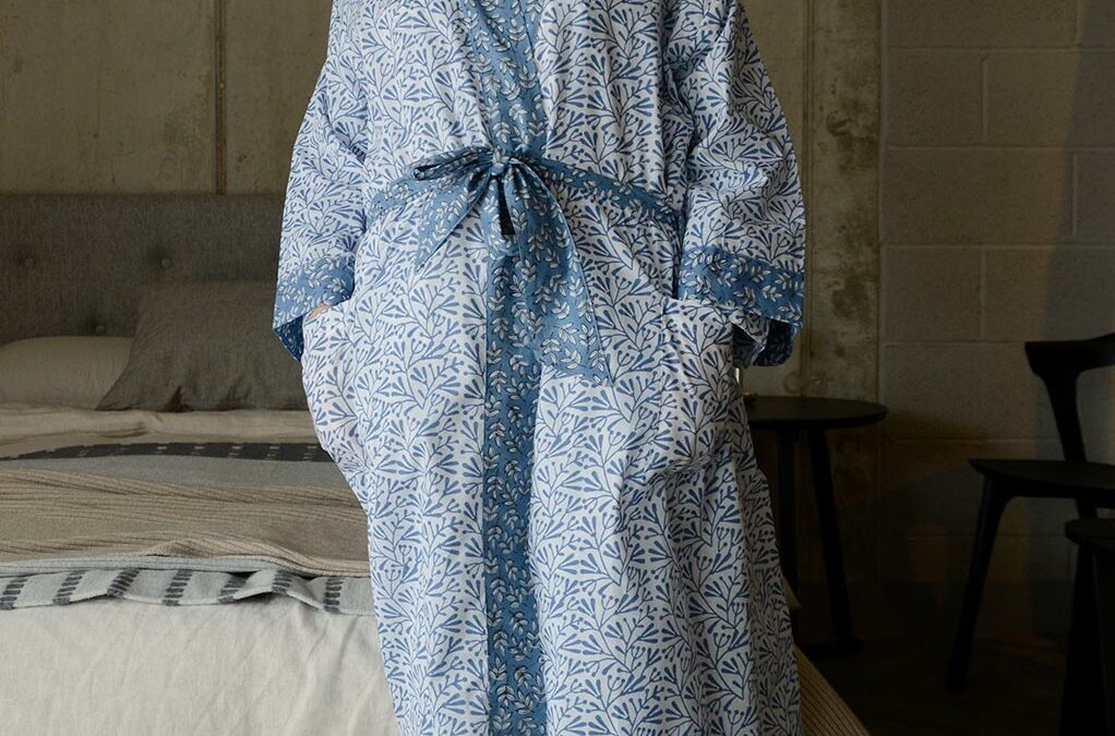 lightweight white cotton robe with a block print leaf design in blue and with contrast belt and cuffs