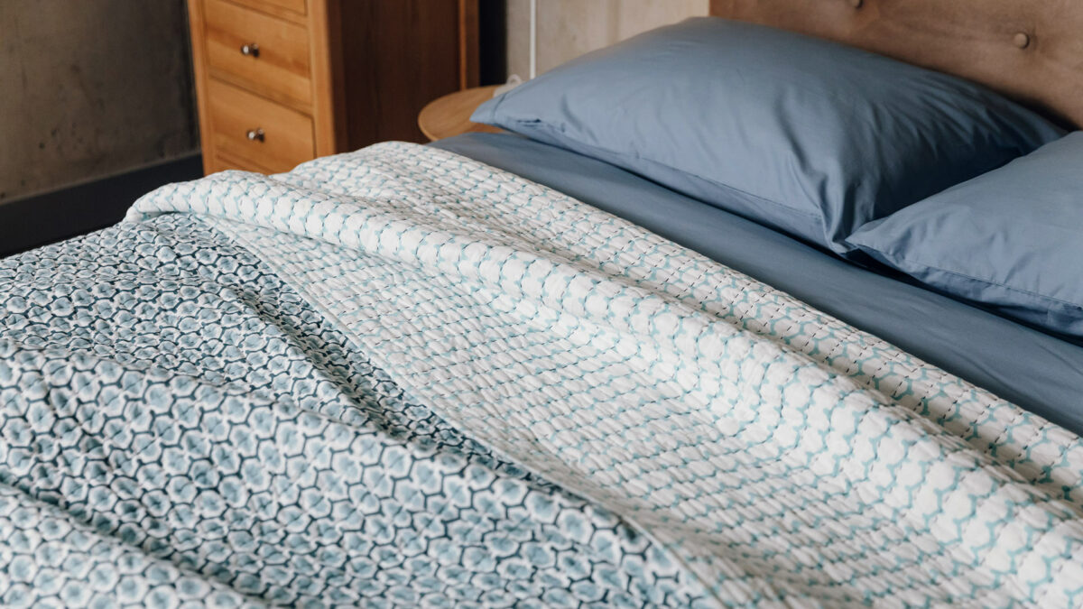 blue and white reversible bedpsread