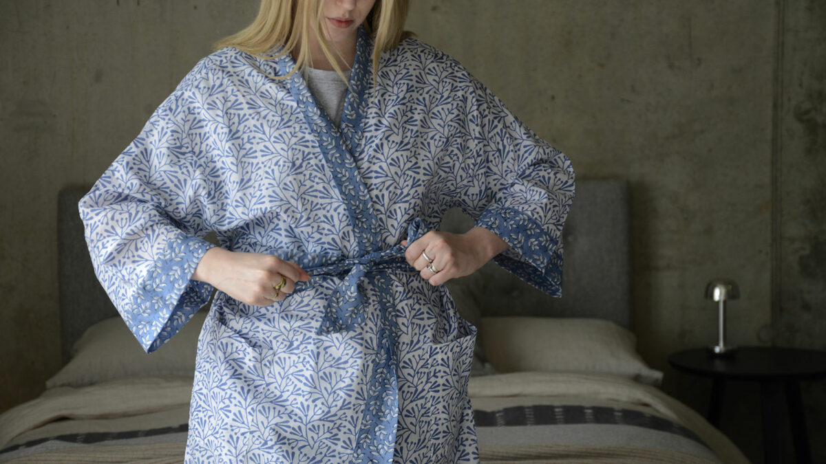 block print light cotton robe with leaf print in Wedgwood blue and white shown on a model