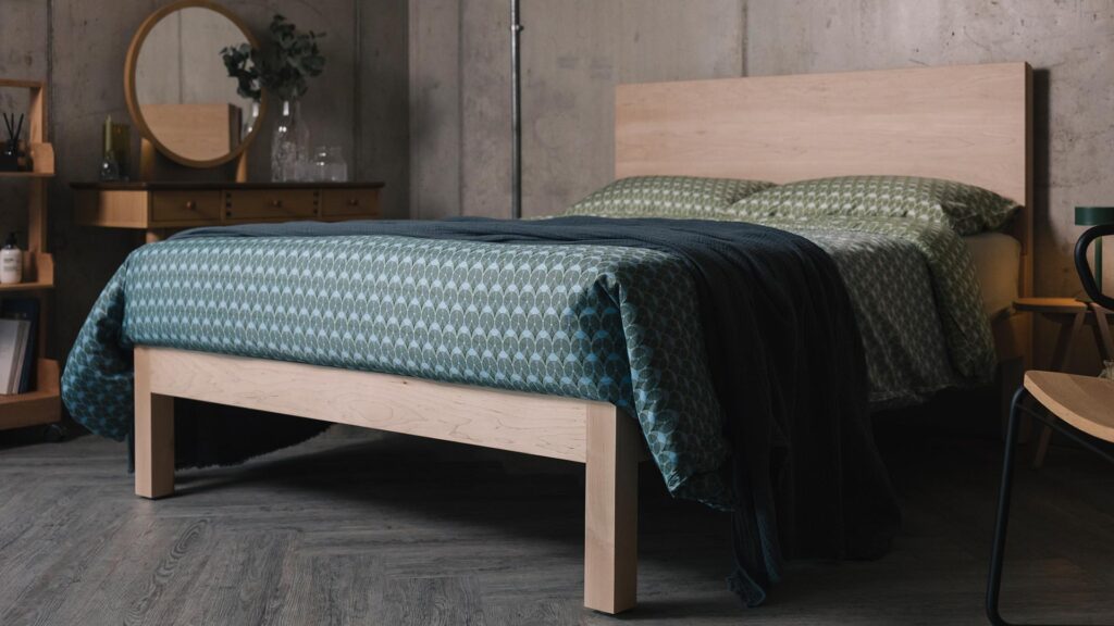 blue green patterned bedding on maple Bamford bed