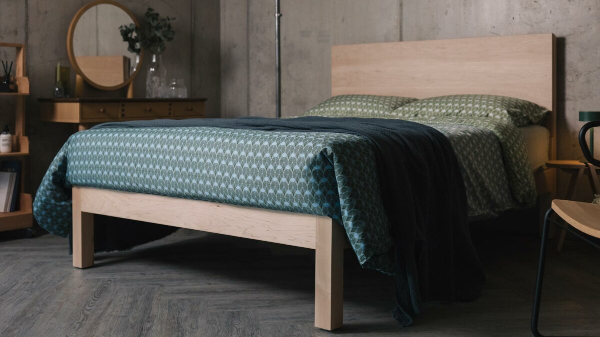 blue green patterned bedding on maple Bamford bed