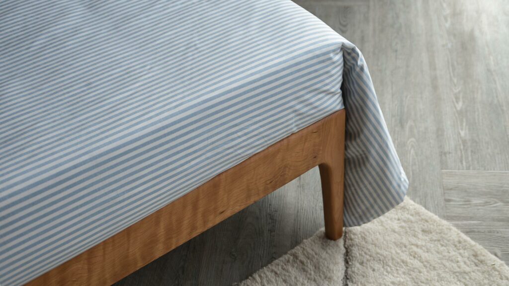 Blue and white striped cotton duvet cover set shown on a kingsize bed