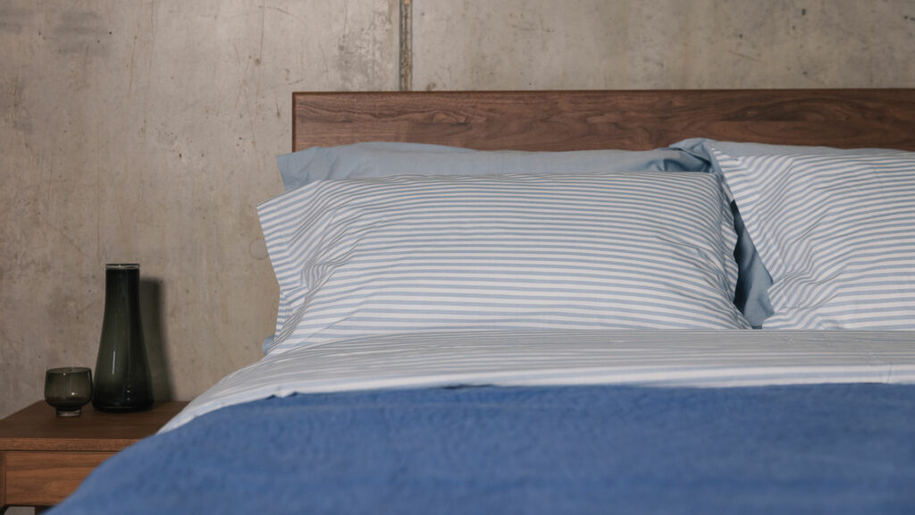 Blue and white striped cotton duvet cover and pillowcase set a view of the pillowcases in use