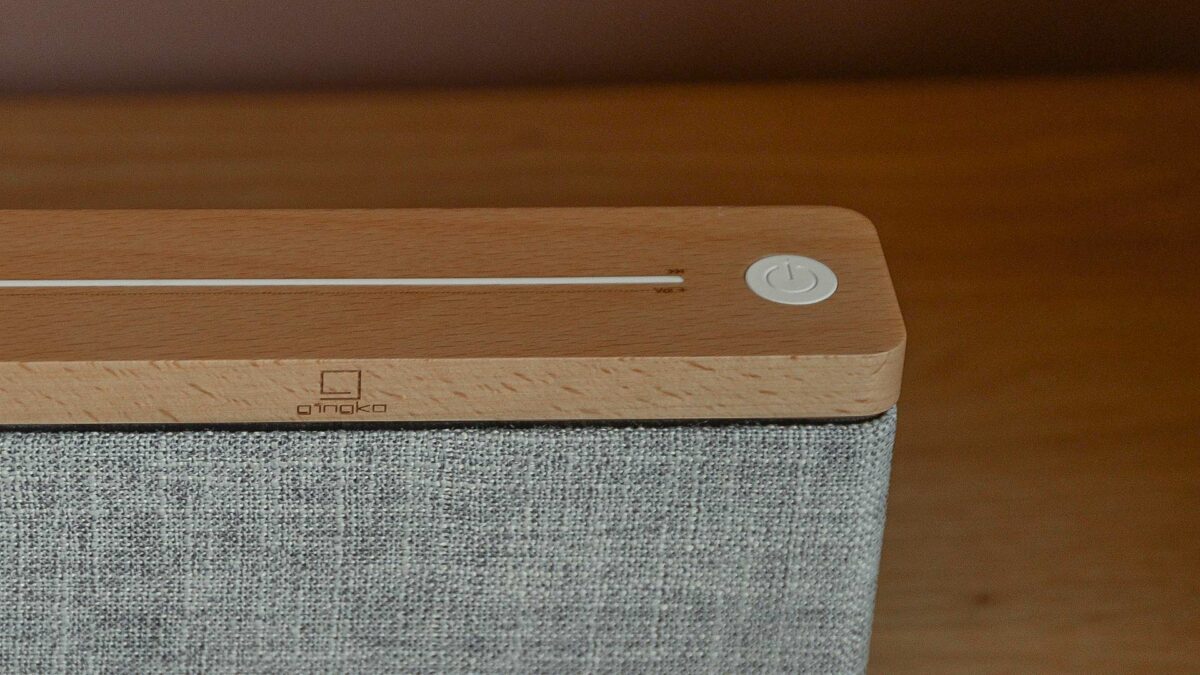 Close-up from above the bluetooth speaker in maple and light grey