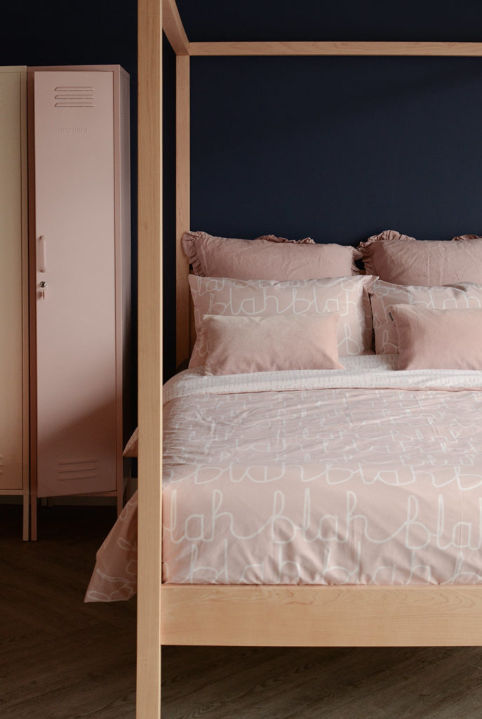 Our Orchid 4 poster wooden bed shown with blush pink bedding