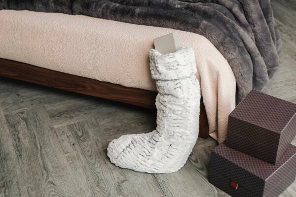 blush pink dapple bedspread with faux fur christmas stocking