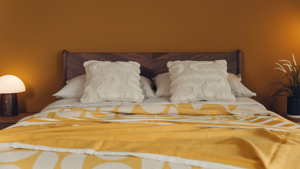 modern Boho look bedding look textured cotton cushions and yellow ochre bedspreads