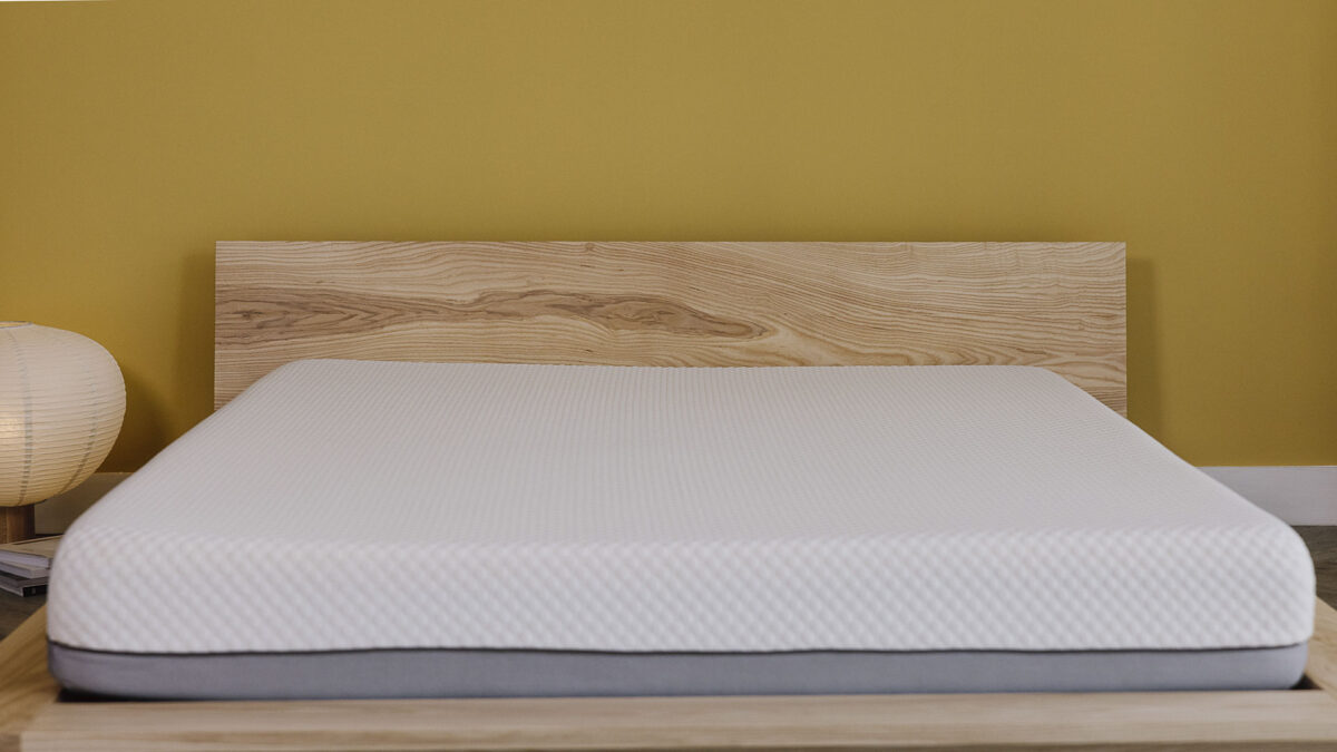 Oregon bed frame with mattress. Photo shows the grain pattern on the headboard.