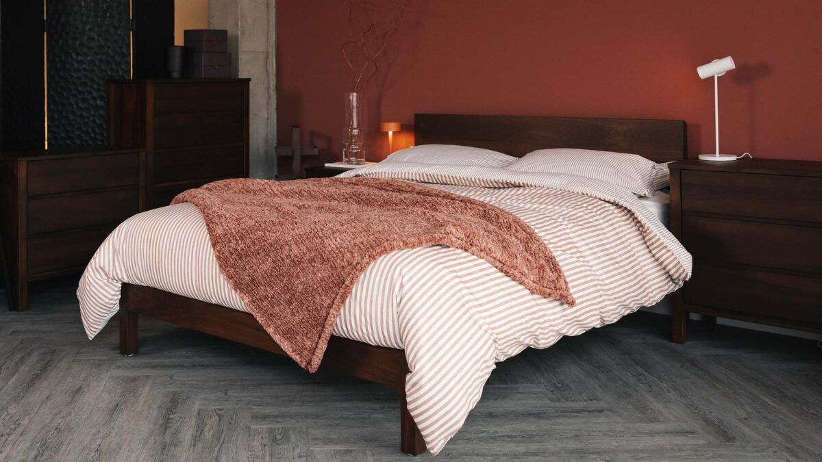 brick red bedding with smoked walnut bed
