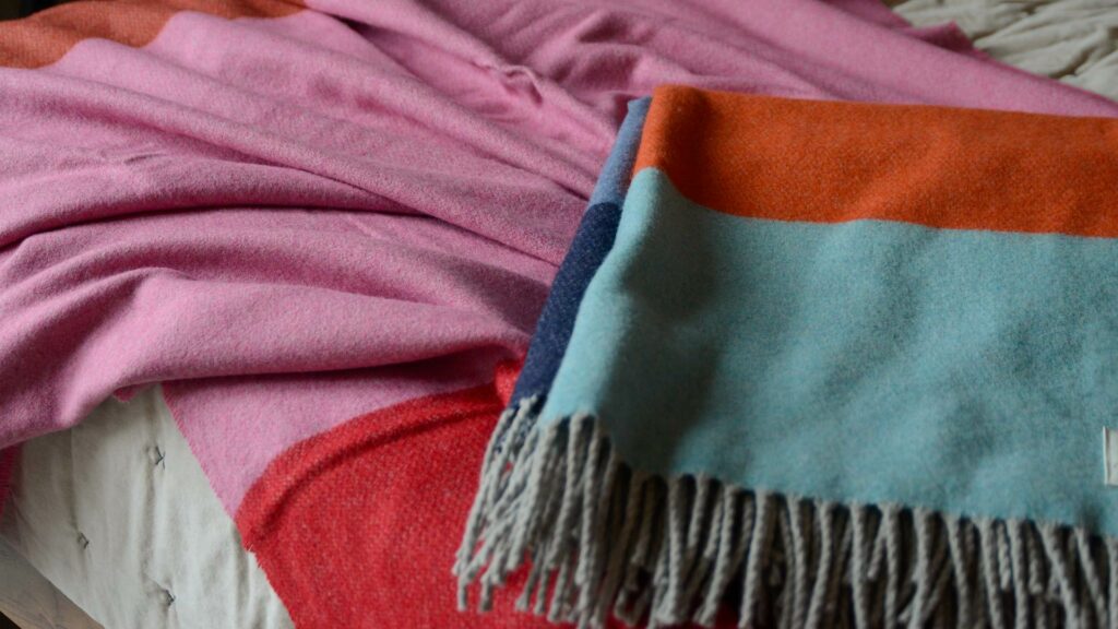 brightly coloured cashmere and merino blend throws
