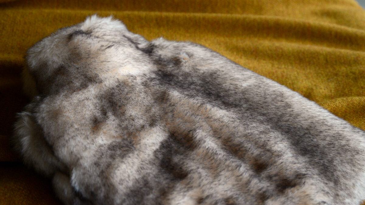 cosy faux fur hot water bottle in snow fox