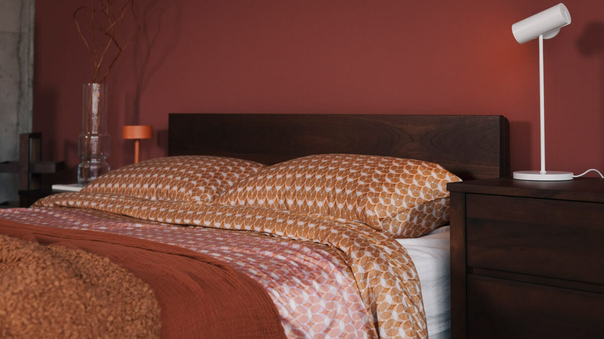 burnt orange and red patterned bedding