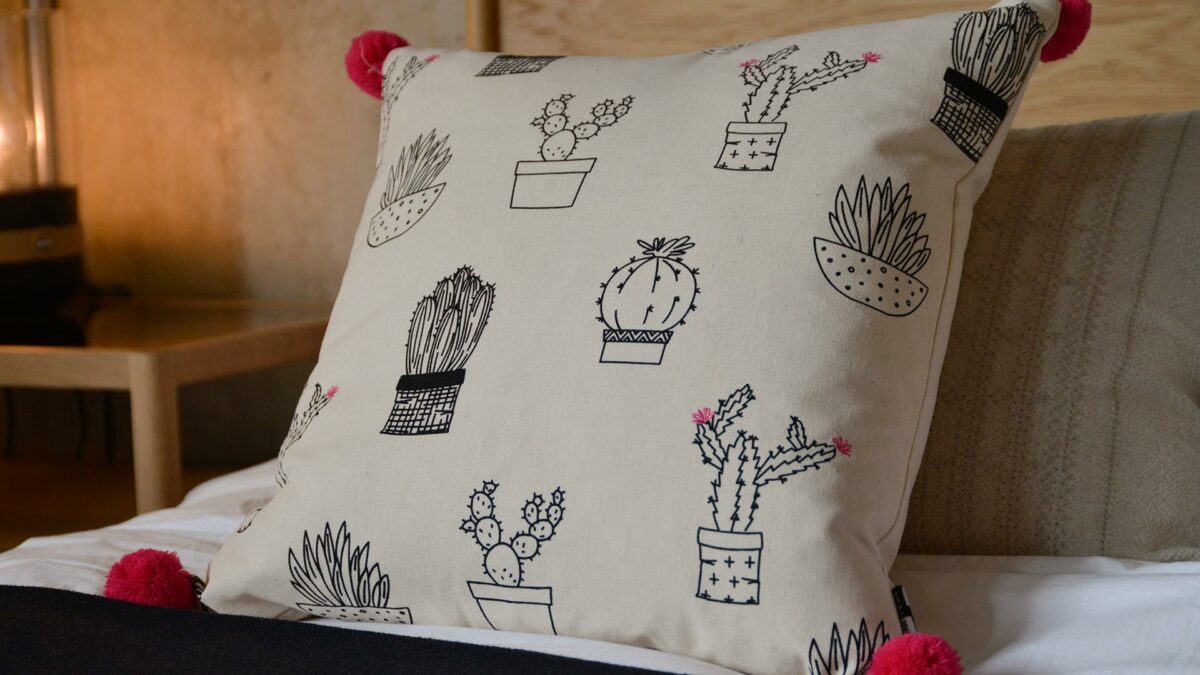 cactus print cushion with pompoms