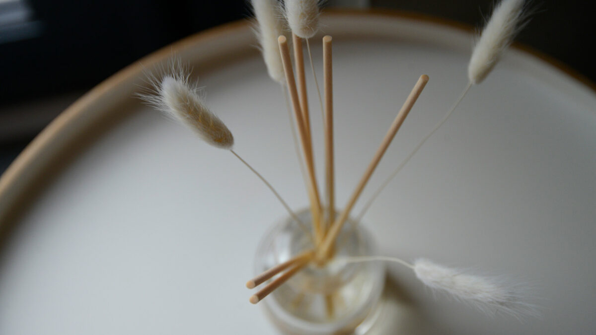 luxury glass room scent diffuser with reeds and bunny tails