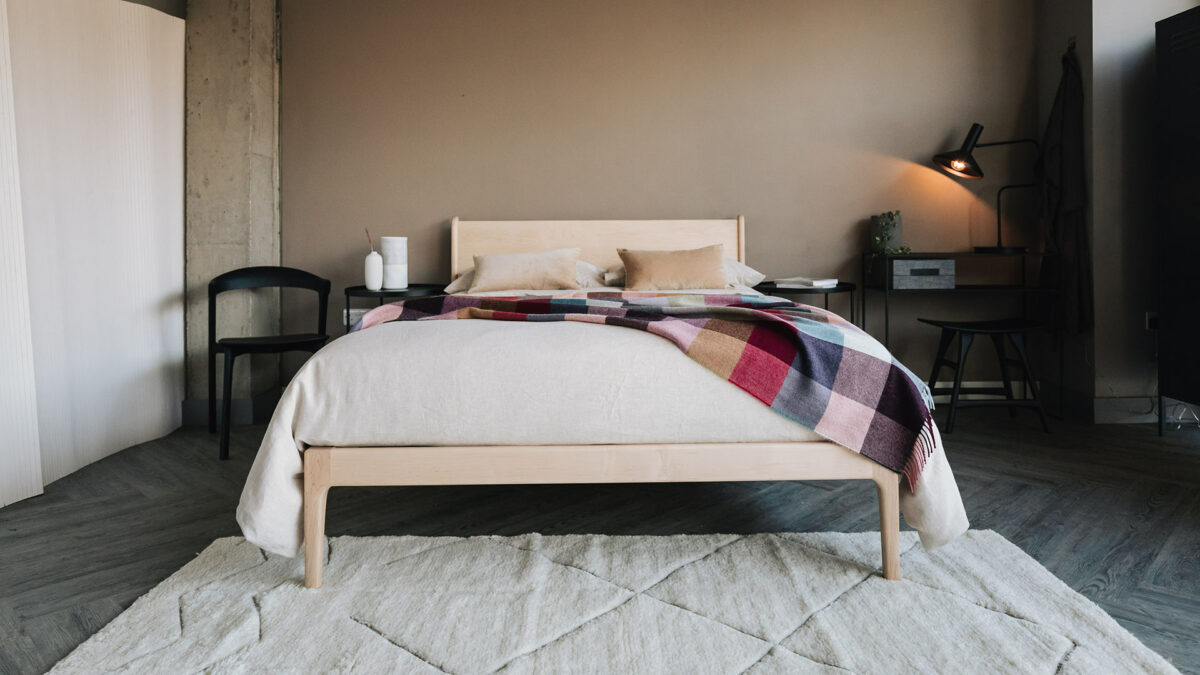 camden bed with colourful block pattern throw
