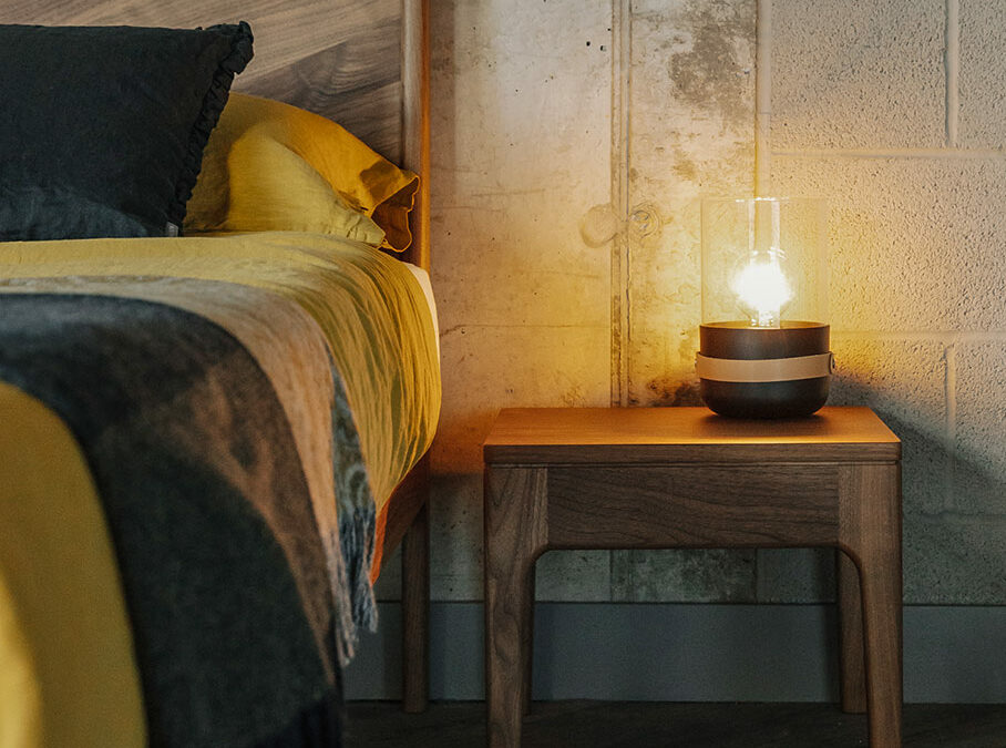 Camden solid wooden table shown with our Walnut Hoxton bed