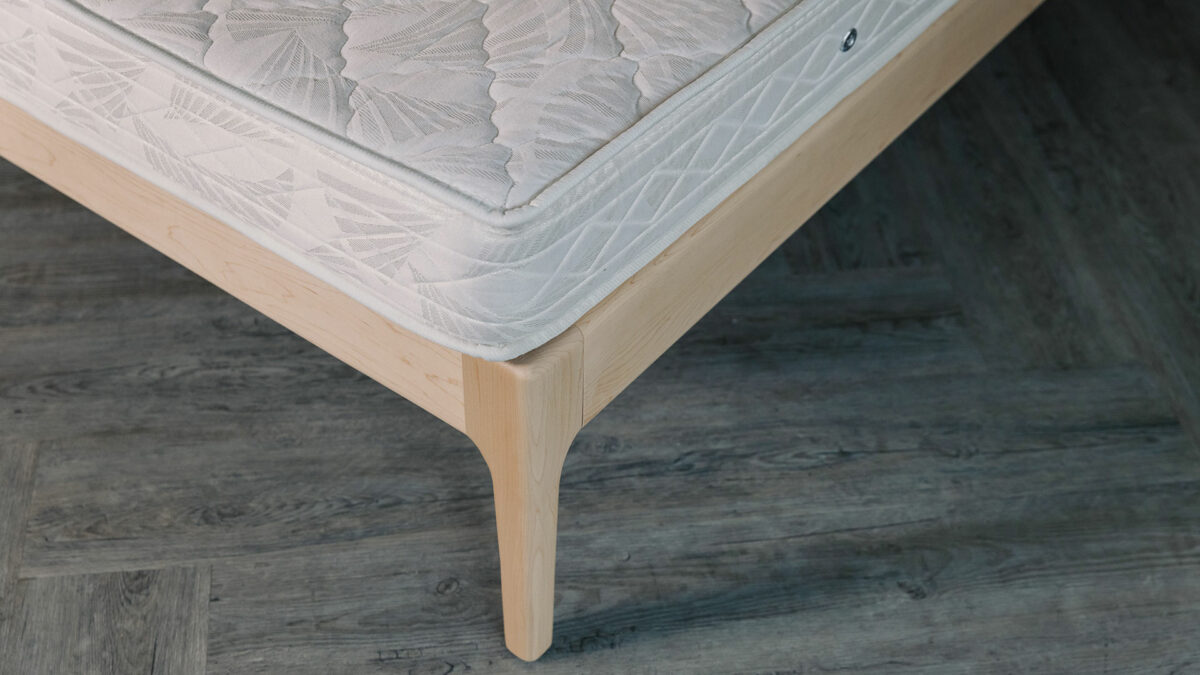 Maple wood Camden bed frame without a headboard a close up of the leg