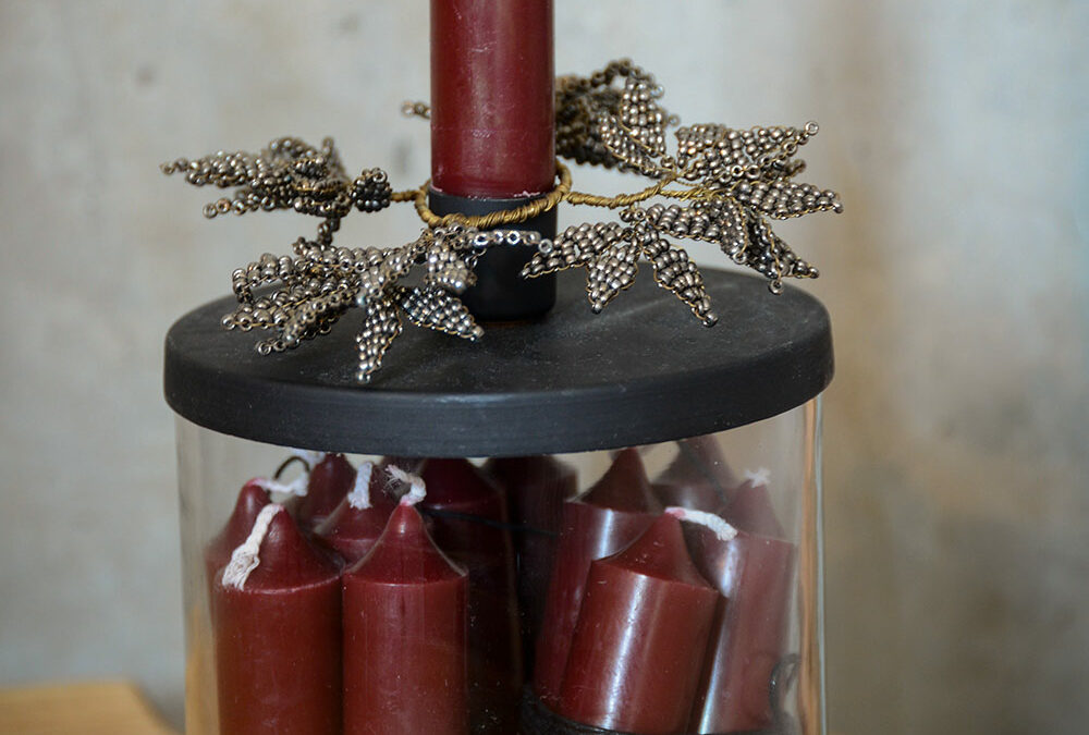 Beaded leaves candle decorations shown on a candle storage pot