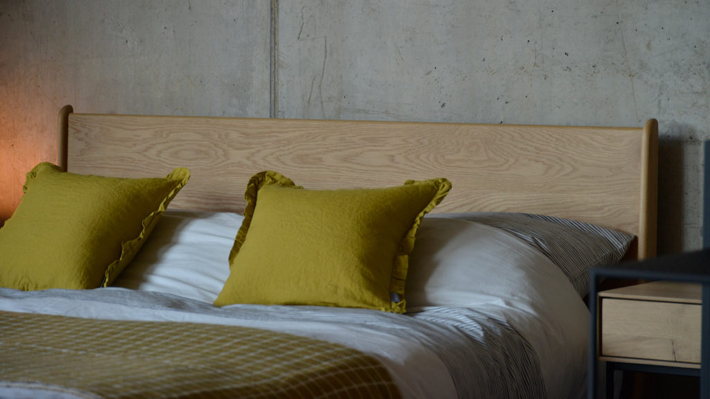 Carnaby handcrafted contemporary wooden bed, here shown in Oak.