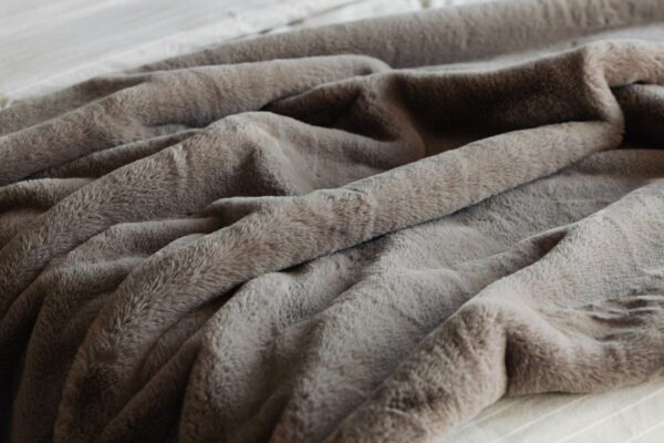 Softest luxury faux fur bedspread in cement grey