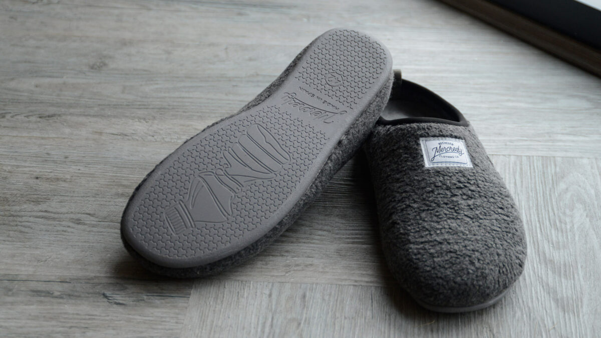 charcoal grey sheepskin look slippers with a sole sustainably made from recycled bottles