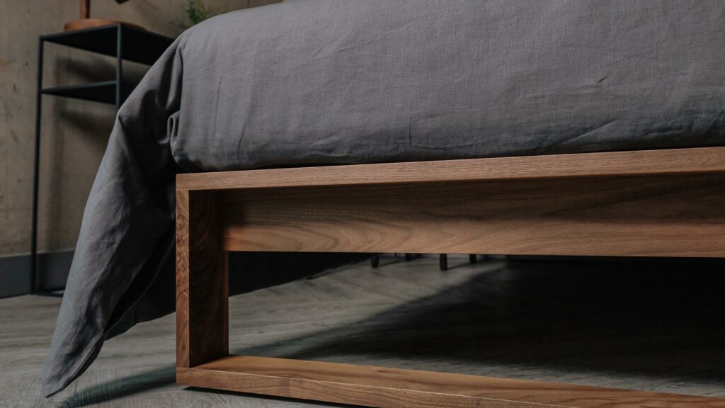 a closer view of the foot end of the solid wood Leith bed in walnut