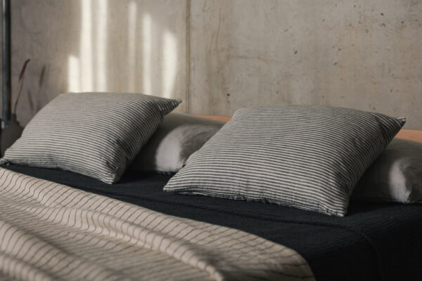 oblong cotton cushions with an ivory and dark grey stripe