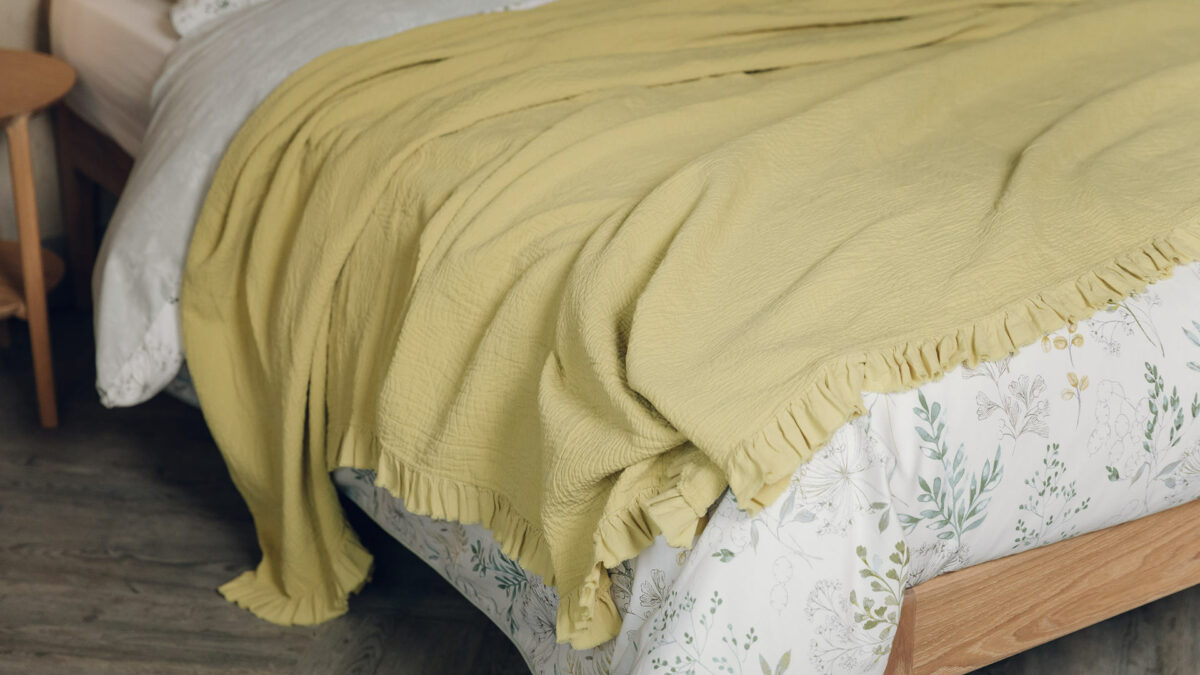 chartreuse textured bedspread with ruffle detail