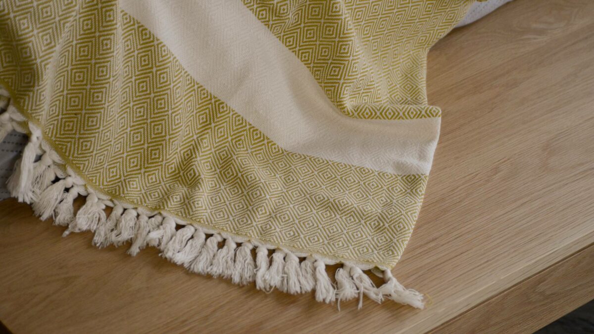 soft woven diamond pattern cotton blanket in cream and chartreuse