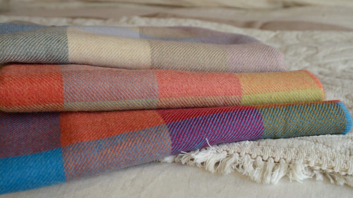 check merino throws   stack   close up
