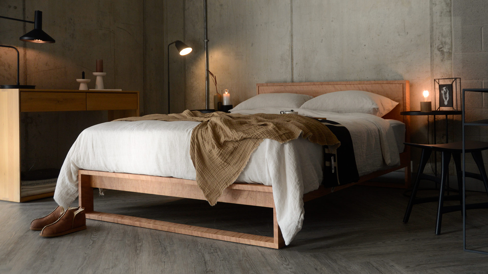 Skandi style bedroom style with linen bedding and a cherry wood bed