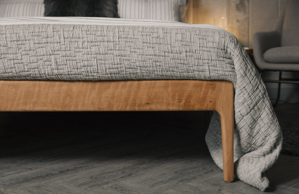 close up view of the Bloomsbury bed leg made in cherry wood