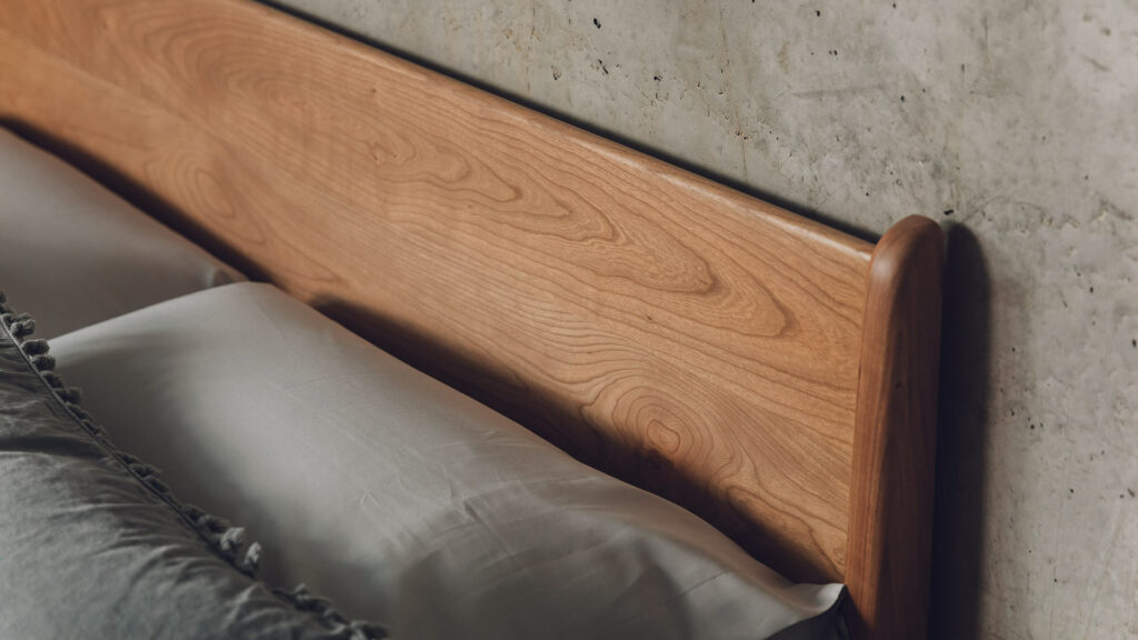 The Carnaby mid century style low bed here a closer look at the headboard made in solid cherry wood