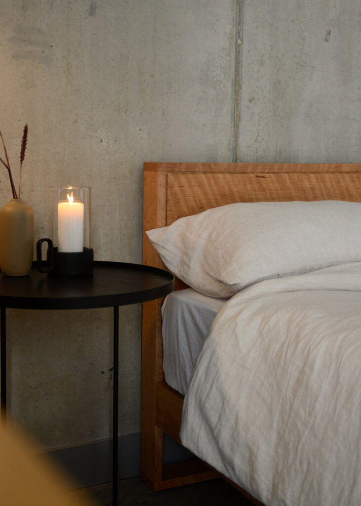 Leith bed headboard in solid cherry wood with a rippled grain