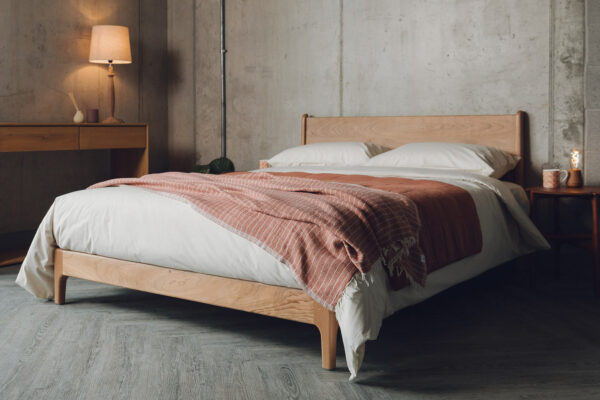 Carnaby a low mid century style bed frame here made in solid cherry wood