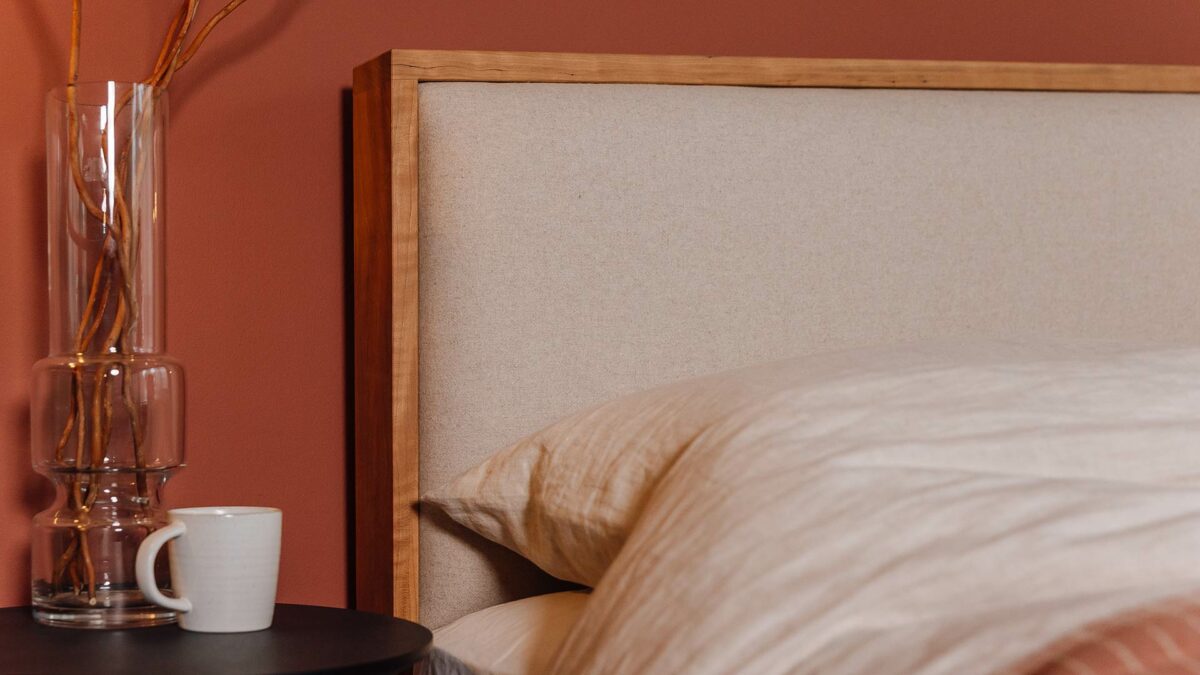 cherry wood bed with Amatheon upholstered headboard Shetland detail