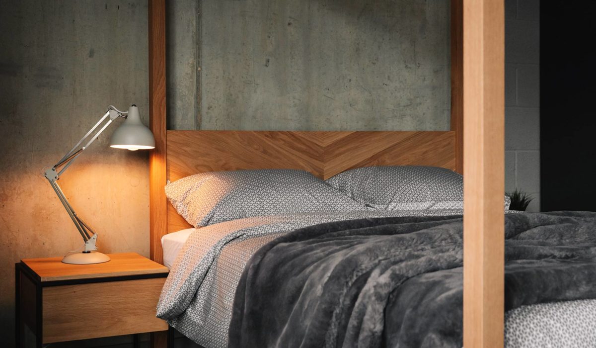 Grey cotton bedding on the contemporary solid wood Kelham 4 poster bed with parquet headboard