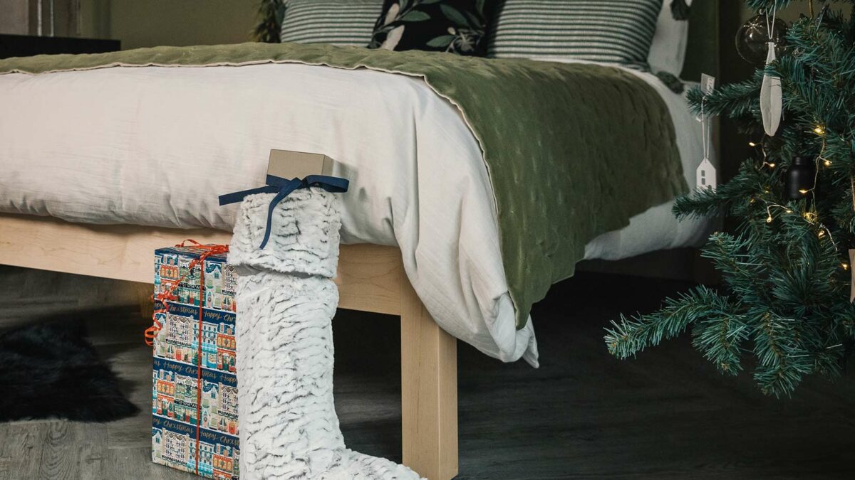 Christmas bedroom with green decor and bedding